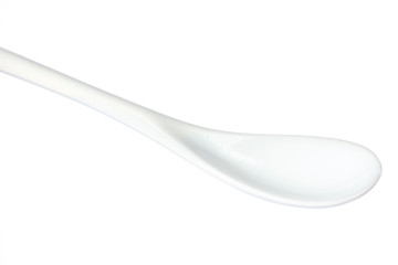 White plastic spoon isolated on white