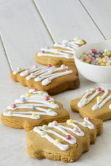 Decorated Christmas Tree Cookies with Bowls of Sugar Pearls  from Above- Copy Space Selective Focus