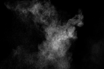 abstract white dust explosion  on a black background. abstract white powder. design elements. abstract texture.