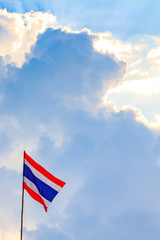 Thai nation flag with blue sky background.