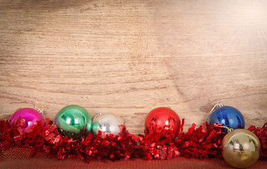 Christmas border with decoration on wooden background