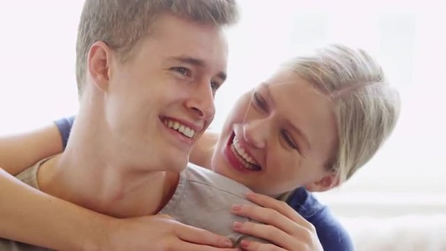 Happy Young couple in love smiling and laughing