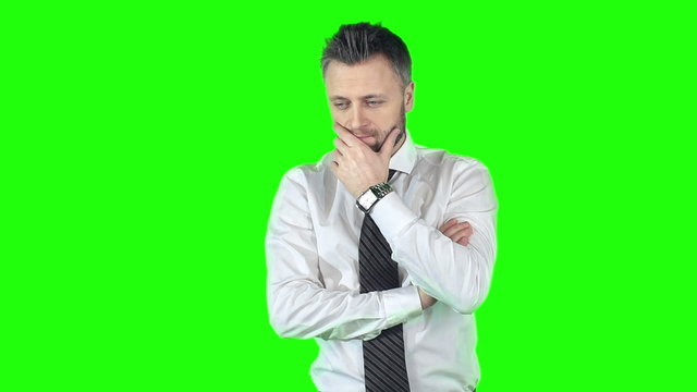 Attractive businessman making hard decision about future of his company