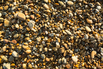 Sea beach pebble stones texture.