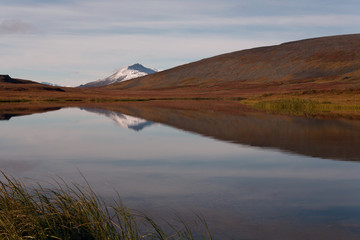 Lake with a reflection in the mountains of the Polar Urals. Russia.
