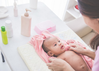 Obraz na płótnie Canvas Cute baby girl enjoying after bathing