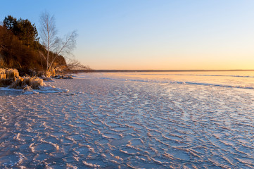 Floe on the shore of a frozen lake