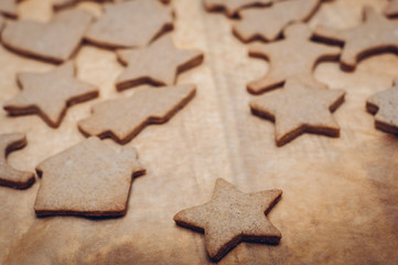 Christmas ginger cookies on wooden background