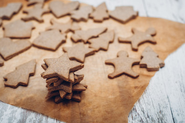 Christmas ginger cookies on wooden background