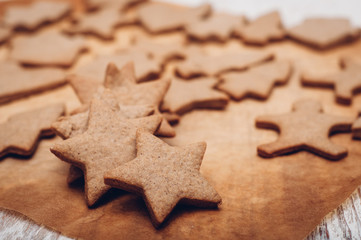 Fototapeta na wymiar Christmas ginger cookies on wooden background