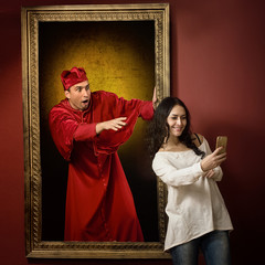 Alive portrait of a medieval priest surprised by the smart phone