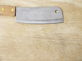 kitchen knife on wooden cutting board