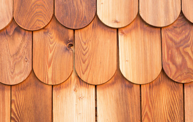 detail of a wood panel made with larch shingles