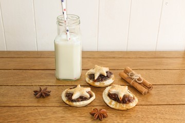Handmade mince pies and a glass of milk, traditionally left out for Father Christmas on Christmas Eve