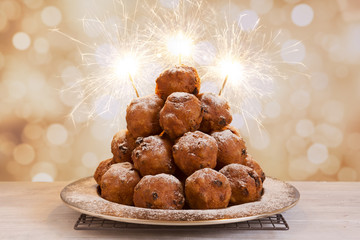 Dutch New Year's Eve with oliebollen, a traditional pastry - 96221215