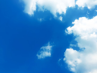 Blue sky with the fluffy cloud