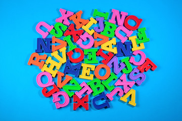 Heap of plastic colored alphabet letters