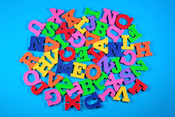 Heap of plastic colored alphabet letters