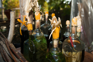 Bottles with alcohol sealed stoppers of ears of corn