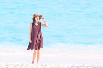 Beautiful asian woman relaxing on the beach