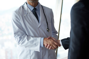 doctor handshake with a patient
