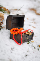 Box with jewellery on the snow winter holidays and Christmas