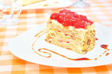 Cake Napoleon with strawberry on the plate