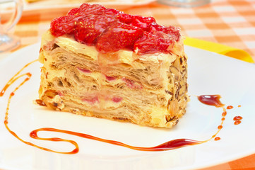 Cake Napoleon with strawberry on the plate