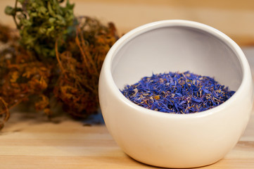 Dry herbs on  wooden background
