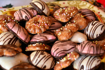 Christmas decorated gingerbread cookies on a plate on a table 