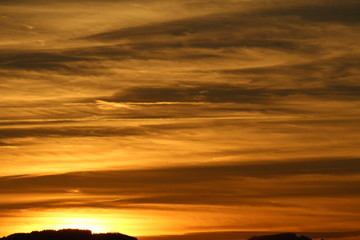 Fototapeta premium St. Gallen - Switzerland hills at sunset, taken from Schoellergasse, Bregenz in Austria.