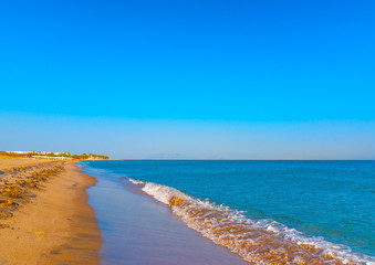 the beautiful long sandy beach at Chelona cape near Kardamaina village at Kos island in Greece