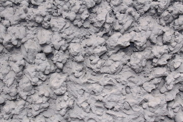 Vintage or grungy gray background of wall with mortar (mixture of natural cement and stone), old texture as a retro pattern layout of construction.