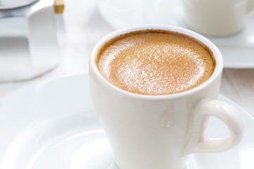 cup of espresso, close-up, selective focus