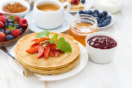 crepes with strawberry, jams and honey 