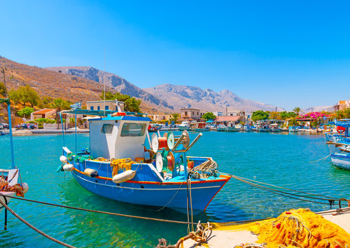 traditional fishing boats  docked at the port of Vathi village in Kalymnos island in Greece