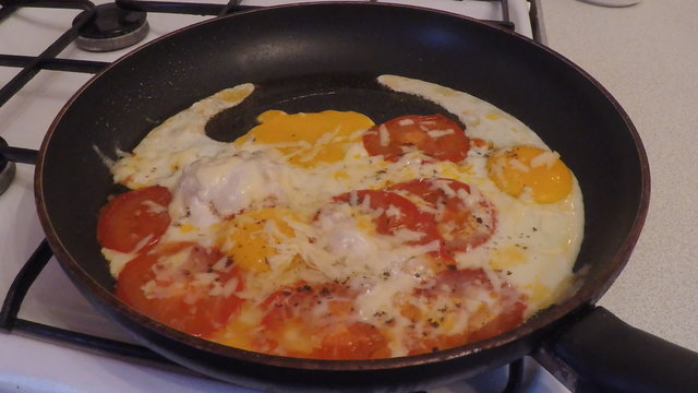 Cooking fried eggs on a hot pan