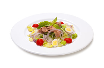 tuna with quail egg tomato and lettuce on a white background
