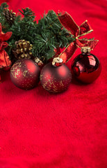 Fototapeta na wymiar Red christmas balls on red background