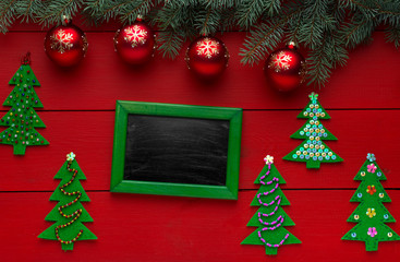 Beautiful wooden christmas background with wooden icons of snowflakes, Christmas trees, stars. New Year's holidays. Insert text. Christmas decorations. Wooden board rustic