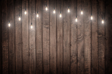 Light bulbs on dark chalkboard background