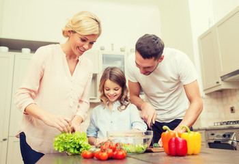 happy family making dinner in kitchen