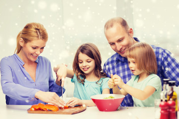 happy family with two kids making dinner at home