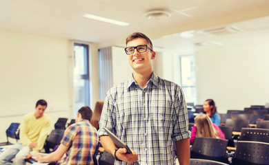 group of smiling students in lecture hall