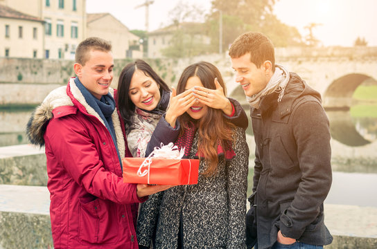 Image of woman guessing what present she is going to receive from her friends