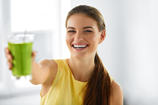 Nutrition. Healthy Eating Smiling Woman Holding Glass Of Fresh Raw Green Detox Vegetable Juice. Healthy Lifestyle, Vegetarian Diet And Meal. Drink Smoothie.