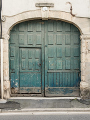 Old antique greenish door in France Europe