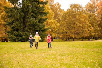 Fototapeta premium group of happy little kids running outdoors