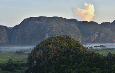 Peaceful view of Vinales valley at sunrise. Aerial View of the Vinales Valley in Cuba. Morning twilight and fog. Fog at dawn in the Valley of Vinales in Pinar del Rio, famous for tobacco plantations