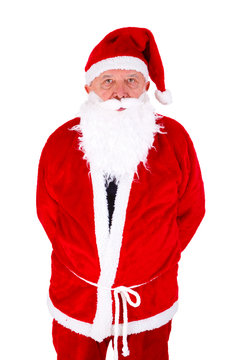 Santa Claus Portrait with sad facial expression. Standing Front View and hides hands behind his back. Isolated on white background